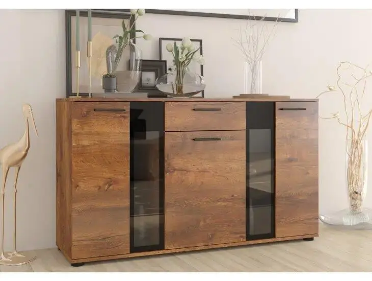 Komoda CARMEN 6 Uporabna in praktična komoda CARMEN 6. Primerna je za dnevne sobe in jedilnice. Debelina iverala je 15 mm. Komoda ima možnost z ali brez LED svetil. Barva: -