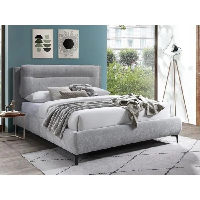 Postelja NIKOLA 160x200 - siva Moderna udobna postelja NIKOLA v sivi barvi, vam bo zagotovila miren spanec. Narejena je iz kakovostnega blaga, kar zagotavlja prijeten in udoben počitek.