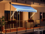 Vpenjalna markiza 250 cm z LED osvetlitvijo – Swing&Harmonie, večerni prikaz