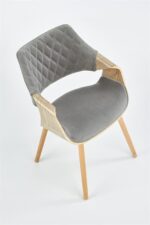 Jedilni stol K396 je dobavljiv v barvi svetli hrast in v sivi tkanini. Noge stola so iz masivnega lesa. Dimenzija: - Š:56/G:55/V:77 cm, Material: - blago -