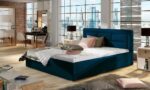 Moderna udobna postelja SORA 2 vam bo zagotovila miren spanec. Dobavljiva je v več barvah blaga. Postelja ima predal za shranjevanje va&scaron;ih stvari.