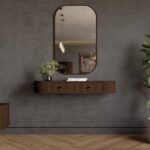 Ovalno ogledalo OVARI oreh je elegantna in priročna. Konstrukcija je narejena iz kakovostne laminirane plošče debeline 16 mm v kombinaciji MDF-ja in stekla.